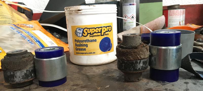 SuperPro bushes next to the tired rubber bushes