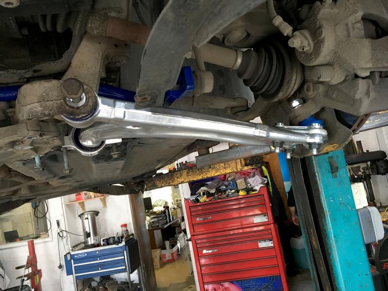 Alloy control arm with camber-adjustable ball joint and front anti-roll bar upgrade