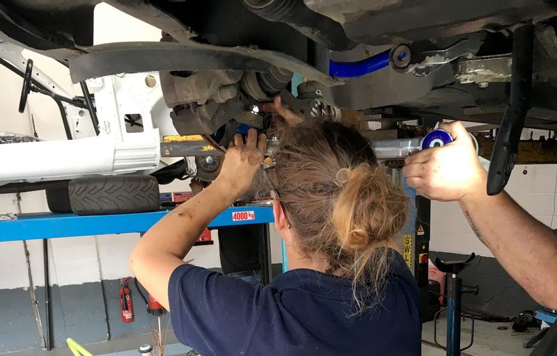 Mel fitting the parts to her own car